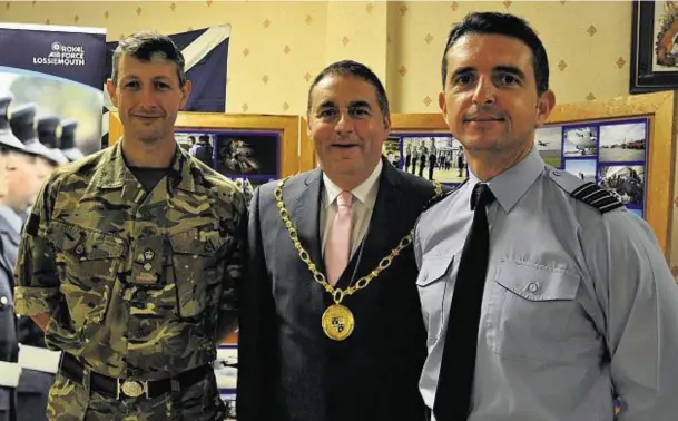  ??  ?? TOP TEAM: Moray Council convener James Allan, centre, with Lt Col Jim Webster, left, of 39 Engineer, Kinloss, and RAF Lossiemout­h commander, Gp Cpt Paul Godfrey