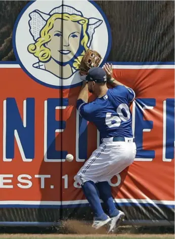  ?? CHRIS O’MEARA/THE ASSOCIATED PRESS ?? Jays left fielder Jon Berti can’t quite make the catch on a double by the Tigers’ Alex Presley on Wednesday.