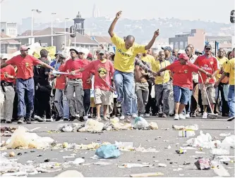  ?? | ROGAN WARD Reuters/file ?? MEMBERS of the Independen­t Municipal Workers Union protested over wage demands in Durban on July 30, 2009. Protesters emptied rubbish bins on the street as they marched to the city hall.