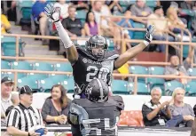  ?? ROBERTO E. ROSALES/JOURNAL ?? Duke City RB Juwan Lewis (20) is hoisted by lineman Oliver Lumpkin after scoring a touchdown in the first quarter during the Gladiators’ CIF playoff victory over Wichita at Tingley Coliseum on Saturday.