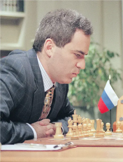  ?? STAN HONDA / AFP / GETTY IMAGES FILES ?? World Chess Champion Garry Kasparov ponders his next move in a match against the IBM Deep Blue computer in 1997. His 16th book, Deep Thinking, is predicated on the contest.