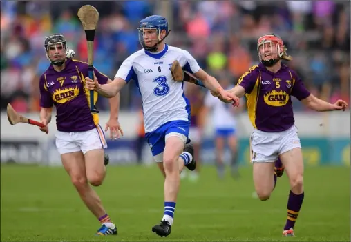  ??  ?? Waterford talisman Austin Gleeson breaking away from Eanna Martin and Diarmuid O’Keeffe during last year’s quarter-final clash in Thurles.