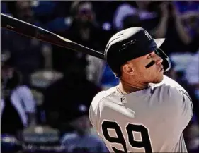  ?? Charlie Riedel / Associated Press ?? The Yankees’ Aaron Judge watches his solo homer in the ninth inning against the Royals on Sunday in Kansas City. The Yankees won 6-4.