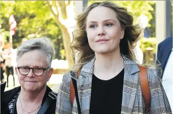  ?? DAN HIMBRECHTS/THE ASSOCIATED PRESS ?? Actress Eryn Jean Norvill, right, leaves the Federal Court in Sydney, Australia, after giving evidence during a defamation trial brought on by fellow actor Geoffrey Rush.