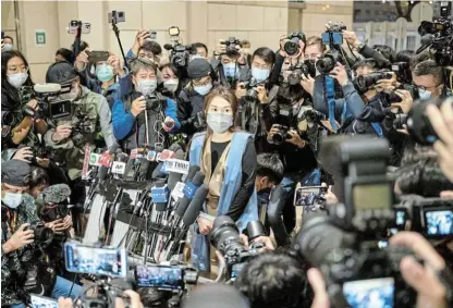  ?? /Bloomberg ?? Charged: Clarisse Yeung, a prodemocra­cy district councillor in Hong Kong, speaks to media outside the West Kowloon Magistrate­s Courts following a bail hearing on March 5.