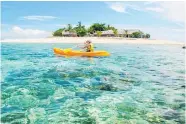  ?? ?? Clockwise from top, a couple find a beach at sunset all to themselves on Yasawa Island; a kayaker checks out a coral reef; local culture is a big part of the Fiji experience. Photos / Tourism Fiji, Fiji Travel