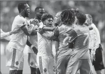  ?? The Associated Press ?? Vancouver Whitecaps Kendall Waston, left, and Yordy Reyna scuffle with Seattle Sounders Osvaldo Alonso, centre, and Roman Torres in Vancouver on Sunday.