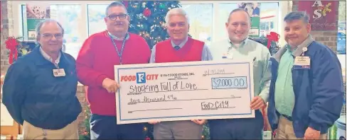  ??  ?? Food City store managers present Walker County Sheriff Steve
Wilson, center, a $2,000 check for the Al Millard Memorial Stocking Full of Love. The Walker County charity is in the 31st year of providing toys and gifts to less fortunate
Walker County children. Donations are accepted year round at P.O. Box 767 LaFayette, Ga. 30728.