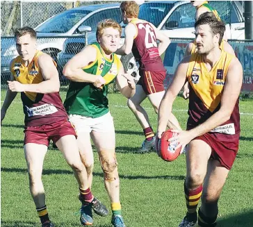  ??  ?? Drouin ruckman Bob McCallum gave the side another great game at all parts of the ground including helping out to clear from the backline with timely support in this instance from Michael Laszczyk’s strong shepherd on a Leongatha opponent.