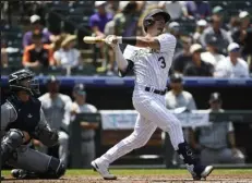  ?? / The Denver Post ?? Catcher Dom Nunez, right, was sent down and Brian Serven was called up before the Rockies hosted the Giants Tuesday night at Coors Field in Denver.