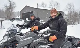  ?? AARON MARBONE/ADIRONDACK DAILY ENTERPRISE ?? Dylan Duffy, left, and Mac Stratford have opened Sara Placid Sled and Spoke on the Adirondack Rail Trail in Saranac Lake, renting snowmobile­s and, eventually, e-bikes.