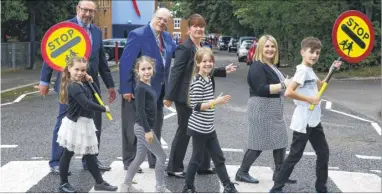  ?? Picture: Andy Jones FM4523465 ?? Cllrs Rob Bird and Dan Daley, head teacher Wendy Skinner and deputy head Samantha Barnett on the new crossing outside Brunswick Primary with pupils Amber, Bea Lois and Zak