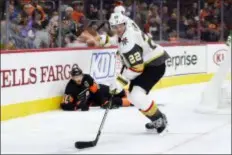  ?? DERIK HAMILTON — THE ASSOCIATED PRESS ?? Nick Holden, right, and the Golden Knights skated by Sean Couturier and the Flyers Saturday afternoon thanks to a goal late in the third period.