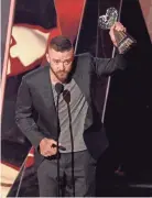  ??  ?? Justin Timberlake accepts the award for song of the year for “Can’t Stop The Feeling!” at the iHeartRadi­o Music Awards at the Forum on March 5, 2017, in Inglewood, Calif. CHRIS PIZZELLO / INVISION/ AP