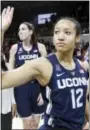  ?? BRANDON WADE — THE ASSOCIATED PRESS ?? Connecticu­t guard Saniya Chong waves to fans following Saturday’s record-setting victory against SMU on Saturday.