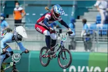  ?? BEN CURTIS — THE ASSOCIATED PRESS FILE ?? Payton Ridenour of the United States, center, and Elke Vanhoof of Belgium, left, compete in the women’s BMX Racing quarterfin­als at the 2020Summer Olympics, July 29 in Tokyo, Japan.