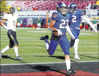  ??  ?? Bishop Gorman senior Amod Cianelli scores one of his six touchdowns against Bishop Manogue in Saturday’s title game. Cianelli finished with 286 yards rushing, including scoring runs of 61, 16, 7, 48, 7 and 7 yards.