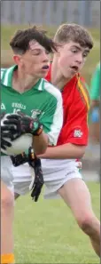  ??  ?? Kyle Kenny (Naomh Eanna) is tackled by Shane Farrell (Starlights) in the abandoned Under-14 football semi-final in St. Patrick’s Park.