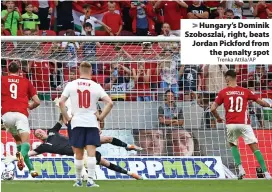  ?? Trenka Attila/AP ?? Hungary’s Dominik Szoboszlai, right, beats Jordan Pickford from the penalty spot