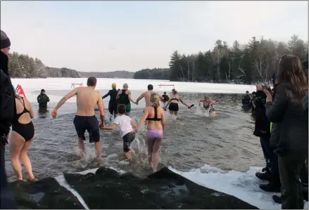  ?? LAUREN HALLIGAN — MEDIANEWS GROUP FILE ?? Adventurou­s event-goers participat­e in the Polar Plunge at the 34th Annual Winter Festival at Grafton Lakes State Park.