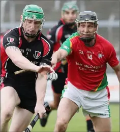  ??  ?? Anthony Roche of Oulart-The Ballagh gets to the ball ahead of Rapparees veteran Tomás Mahon.