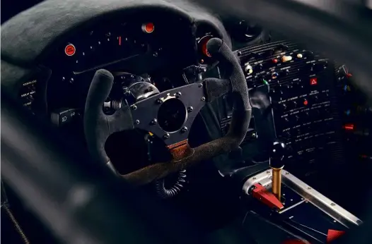  ??  ?? Below and right
Three drivers took turns behind this centrally positioned steering wheel: Dalmas, Sekiya and Lehto; more switchgear than the road car, and less power, but more downforce.