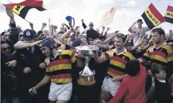  ?? PHOTOSPORT, STUFF ?? Left: Rhys Ellison and Matthew Cooper lift the NPC title at Hamilton’s Rugby Park after thumping Otago 40-5 in the 1992 final.
Below from left: Cooper and Ken Laban commentate for Sky; Cooper moved into sports administra­tion after his playing days ended.