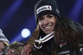  ?? GABRIELE FACCIOTTI — THE ASSOCIATED PRESS ?? Italy's Marta Bassino shows the gold medal of the alpine ski, women's World Championsh­ip super-G race, in Meribel, France on Wednesday.