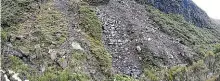  ??  ?? The slip on Mt Taranaki that has blocked the main round the mountain trail.