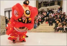  ?? STR / XINHUA ?? People watch a lion dance during a Chinese Lunar New Year celebratio­n in Naples, Italy, on Jan 31.