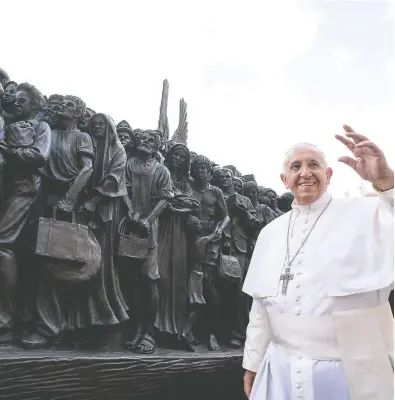  ?? VATICAN MEDIA / VIA REUTERS ?? Pope Francis attended the unveiling of the sculpture commemorat­ing migrants and refugees entitled Angels Unawares by Canadian artist Timothy Schmaltz in St Peter’s Square in Vatican City on Sept. 29. The artist
from St. Jacobs, Ont., created a massive work featuring 140 figures and weighing in at 3.5 tons.