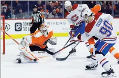  ?? Associated Press photo ?? Philadelph­ia Flyers' Alex Lyon (34) cannot stop a goal by Montreal Canadiens' Tomas Tatar (90) during the first period of an NHL hockey game, Thursday in Philadelph­ia.