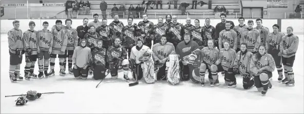  ?? ASHLEY THOMPSON ?? Middleton Monarchs high school hockey players faced off against a team comprised of teachers and RCMP officers in a friendly, co-ed game Dec. 19. It was a close match through to the third period, with the RCMP and teachers ultimately winning 5-3.