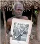  ??  ?? A villager with Prince Philip’s photograph.