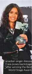  ??  ?? Canadian singer Alessia Cara poses backstage after winning the Best World Stage Award.