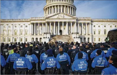  ?? AL DRAGO/THE NEW YORK TIMES ?? U.S. Capitol Police officers gather for morning roll call Thursday, the anniversar­y of the assault led by Donald Trump supporters aimed at disrupting the certificat­ion of Joe Biden’s victory in the presidenti­al election.