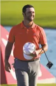  ?? Dante Carrer / Associated Press ?? Jon Rahm celebrates after winning the Hero World Challenge in the Bahamas.