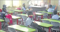  ?? DEEPAK GUPTA/HT PHOTO ?? Kids attending school while maintainin­g social distancing in Lucknow.