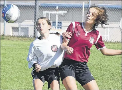  ?? TRURO DAILY NEWS PHOTO ?? Chloe Lindsay, right, of the CC Riders battles for the ball with Ellison Collens of Cole Harbour Eastern Passage in the opening game of the provincial under-13 A soccer championsh­ip tournament. Lindsay scored twice to pace the Riders to a 3-0 win over...