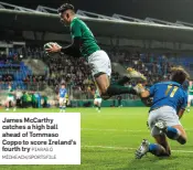  ?? PIARAS Ó MÍDHEACH/SPORTSFILE ?? James McCarthy catches a high ball ahead of Tommaso Coppo to score Ireland’s fourth try