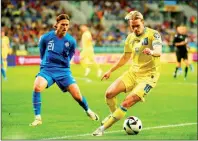 ?? PHOTO: REUTERS ?? Iceland’s Arnor Traustason, left, vies for the ball with Ukraine’s Mykhailo Mudryk in their Euro 2024 qualifier at the Stadion Miejski in Wroclaw, Poland, on Tuesday.