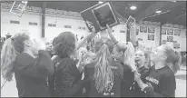  ?? LORI RILEY/HARTFORD COURANT ?? The E.O. Smith girls basketball team celebrates after winning the CCC tournament championsh­ip by defeating Newington on Thursday.