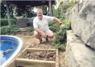  ?? DAVID BEBEE WATERLOO REGION RECORD ?? Mark Stapleton beside a rat’s nest he found after tearing out a pool deck in the backyard of his Waterloo home.