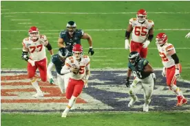  ?? Photograph: Sean M Haffey/Getty Images ?? Patrick Mahomes made a number of crucial scrambles during the second half of Sunday’s game.