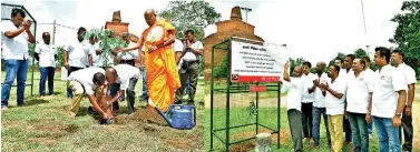  ??  ?? Nimal Tillekerat­ne – Director/CEO of Pan Asia bank is seen planting the very first medicinal plant in the Jethavanar­amaya sacred garden, and inaugurati­ng the tree planting project.