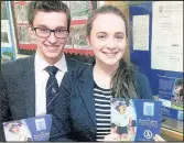  ??  ?? Market Bosworth Dixie Grammar School head boy Christian Smaditch and head girl Kate Smart in front of a display promoting the newly formed Heathcote Foundation, set up to support students from families requiring financial support with a bequest from...