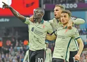  ?? — AP ?? Liverpool’s Sadio Mane (left) celebrates with his teammates after scoring against Aston Villa during their EPL match at Villa Park in Birmingham on Tuesday.