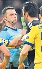  ??  ?? Gianluigi Buffon confronts referee Michael Oliver after his controvers­ial spot-kick award.
