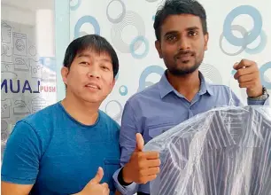  ?? Supplied photos ?? Rommel with Shahul Ahmed at Crystal Clean laundry in Business Bay. The shop is offering free service to job aspirants throughout the year as part of its Year of Giving initiative. —