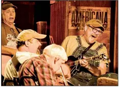  ??  ?? The Station Inn, a favorite Nashville roots music venue, holds bluegrass jam sessions on Sunday nights. Here Carl Caldwell sings and plays mandolin.